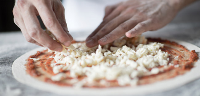 preparing a pizza